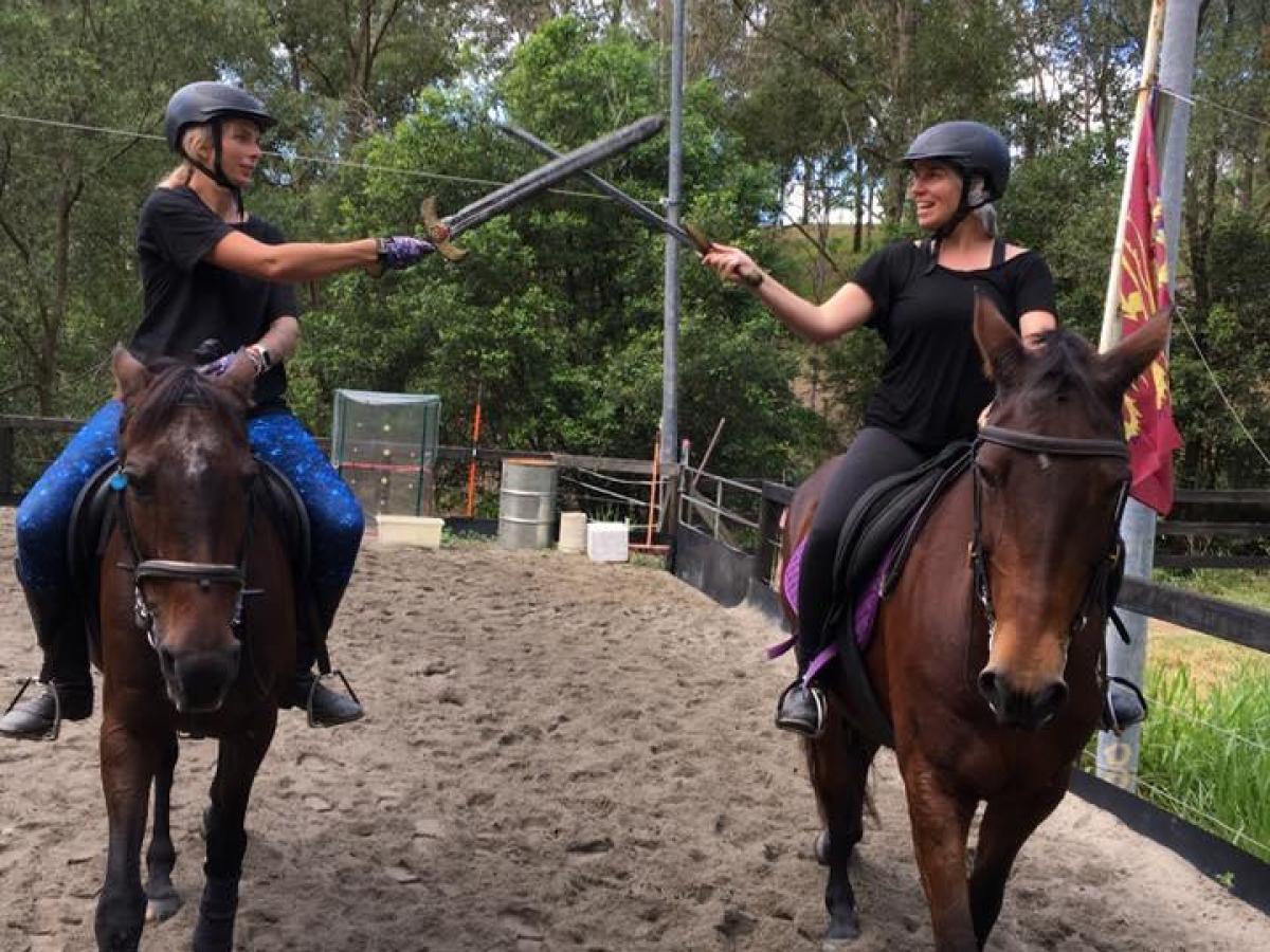 a person riding a horse in the dirt