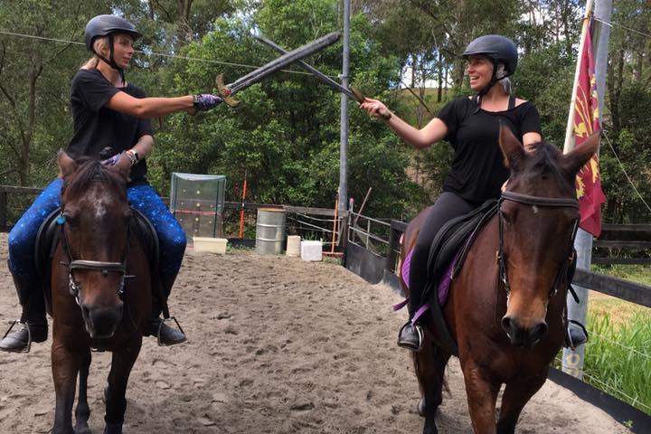 a person riding a horse in the dirt