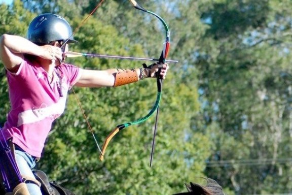 a person swinging a bat at a ball