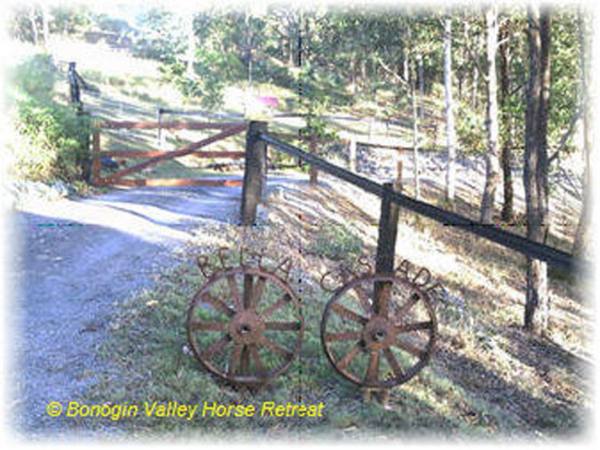 a bicycle parked on a dirt road