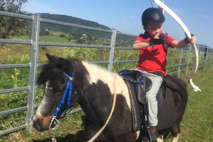a group of people riding on the back of a horse